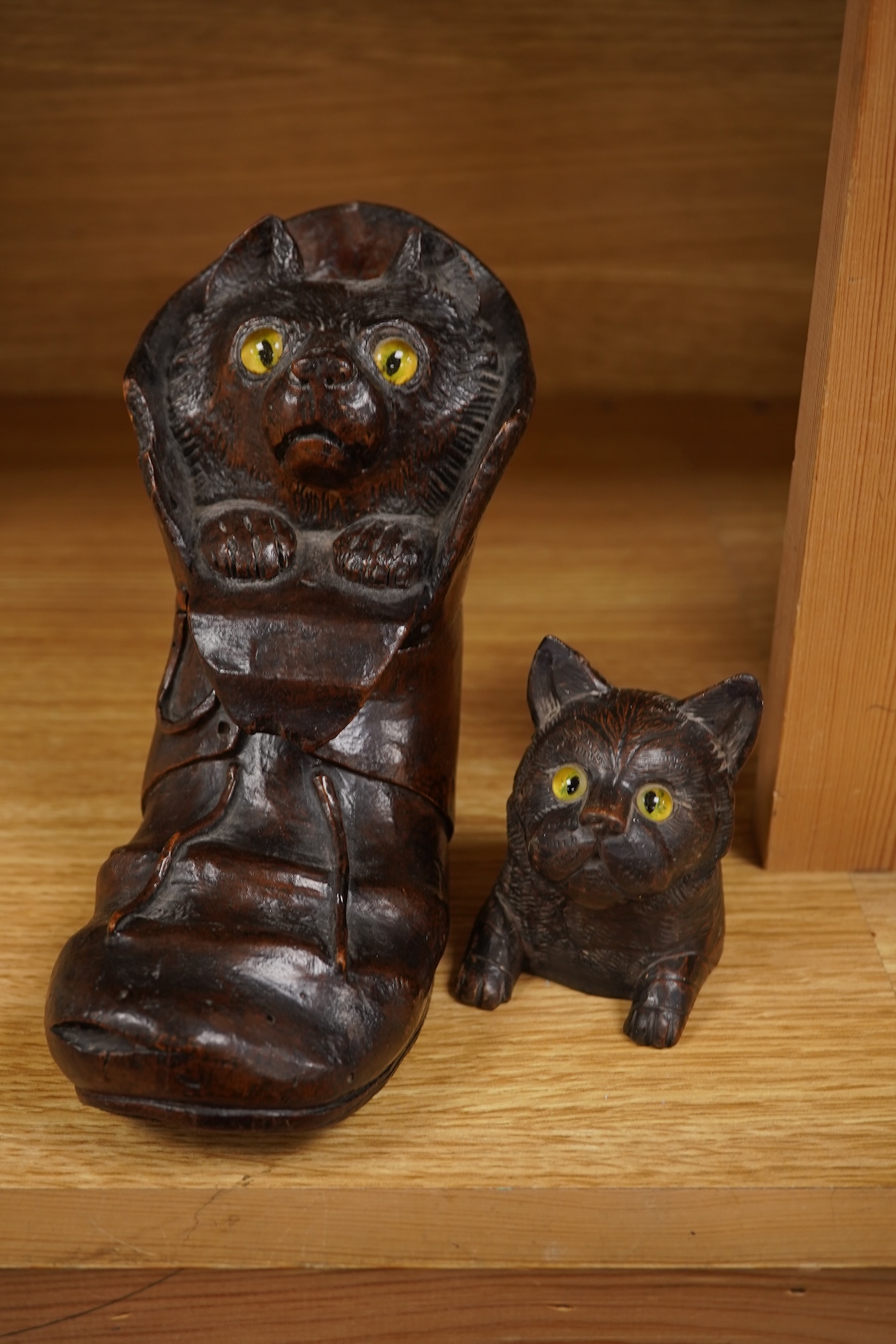 A Black Forest carving of a kitten in a boot inkwell and another car inkwell, tallest 15cm